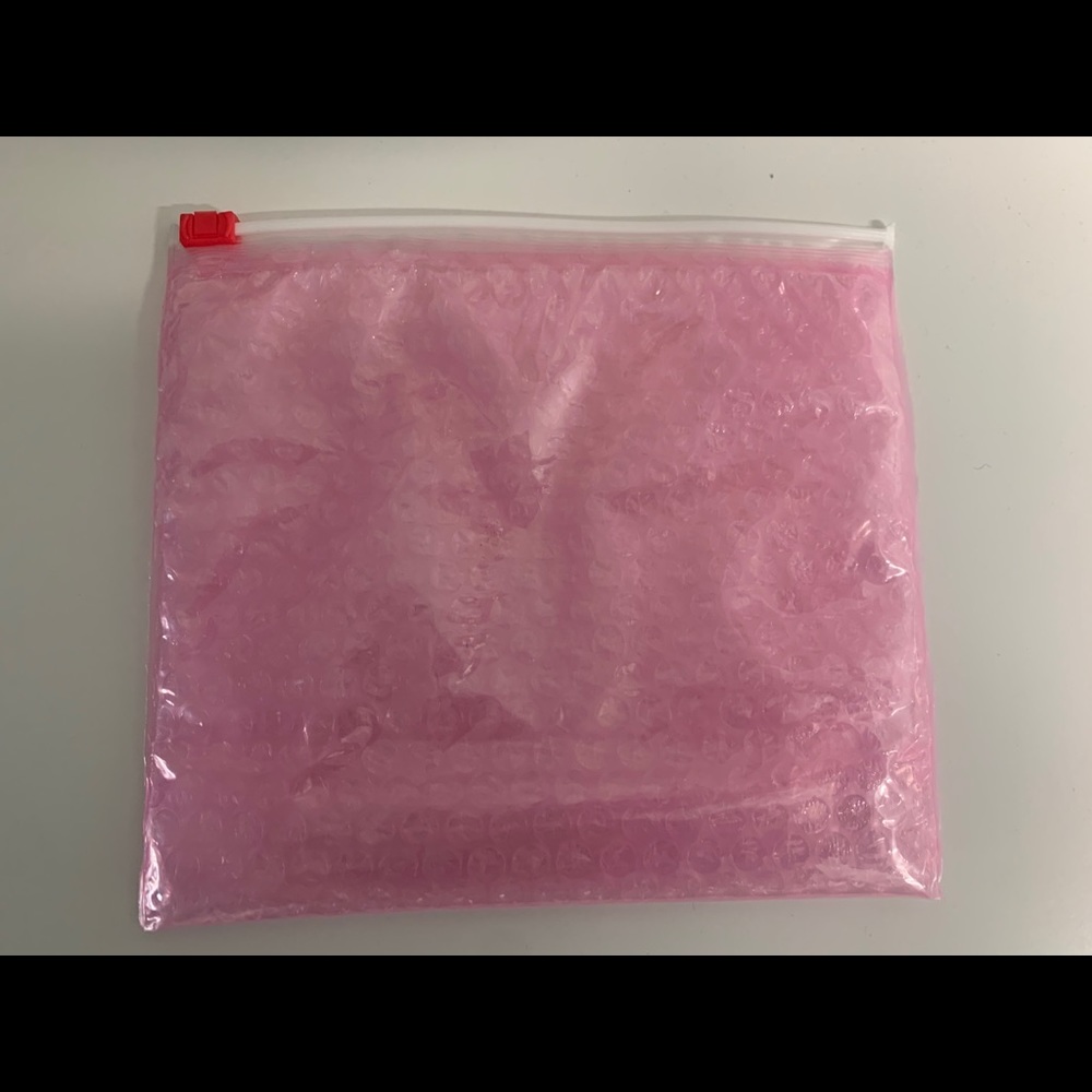 Glossier makeup pouches